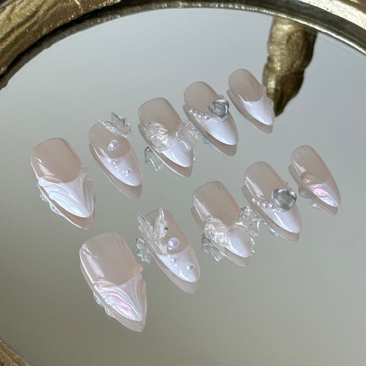Close-up detail of 3D transparent butterflies and sculpted water ripple lines by MYOB Nails.