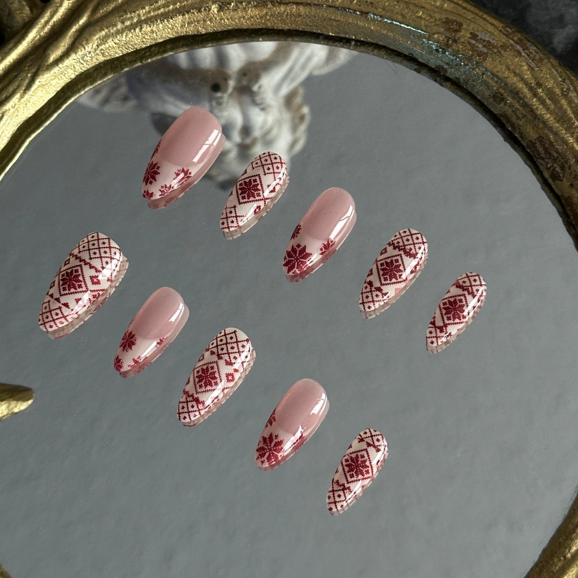 burgundy Fair Isle knit pattern French tip nails texture