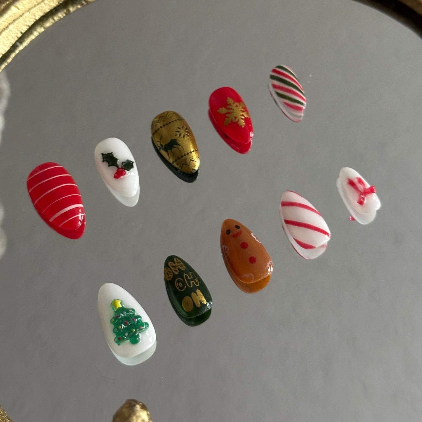 gingerbread man gold Fair Isle snowflake press-on nails detail
