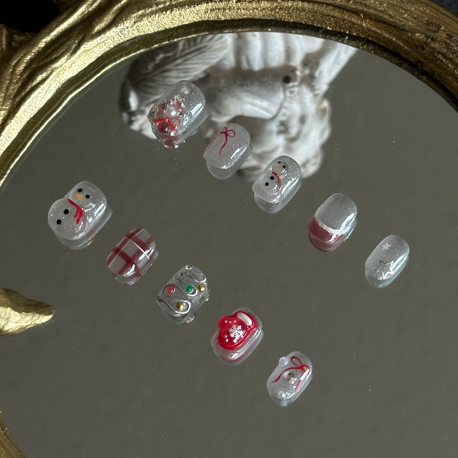 translucent snowman silver cat-eye press-on nails detail
