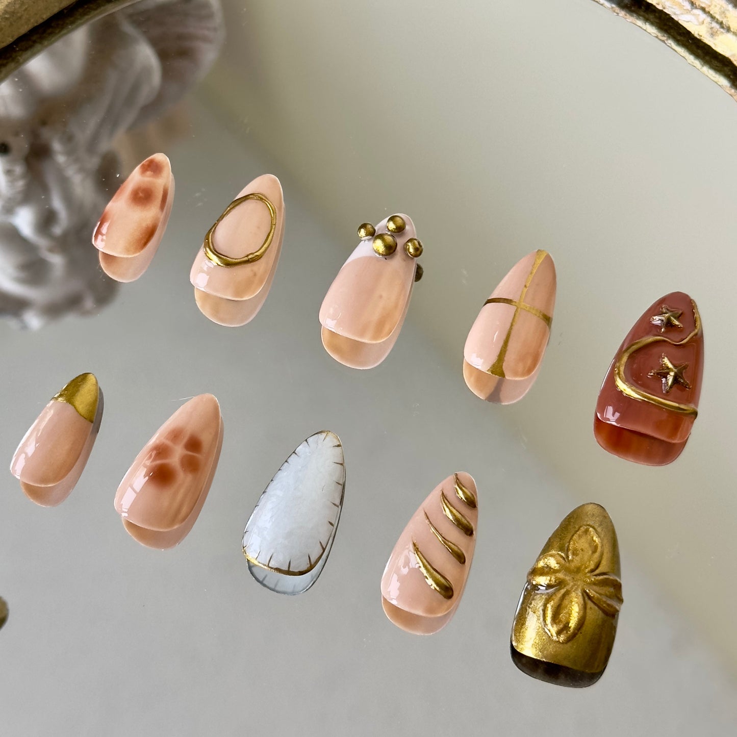 Back view showcasing the regal almond shape and the sophisticated baroque aesthetic of Auric.