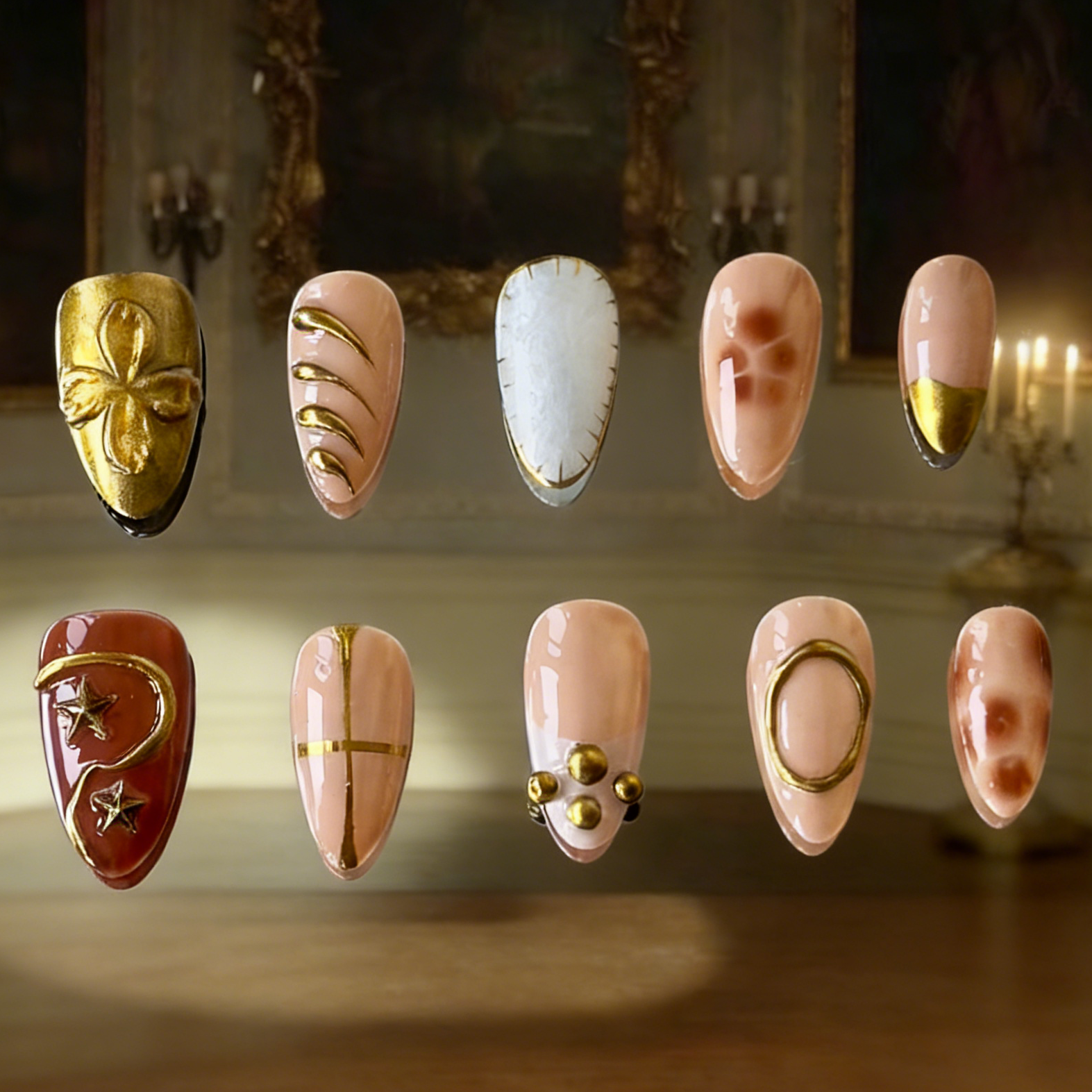 Auric press-on nails by MYOB Nails featuring gold chrome, brown tortoise marbling, and white shell gel textures.