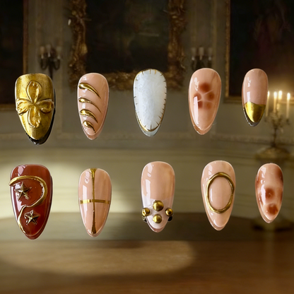 Auric press-on nails by MYOB Nails featuring gold chrome, brown tortoise marbling, and white shell gel textures.