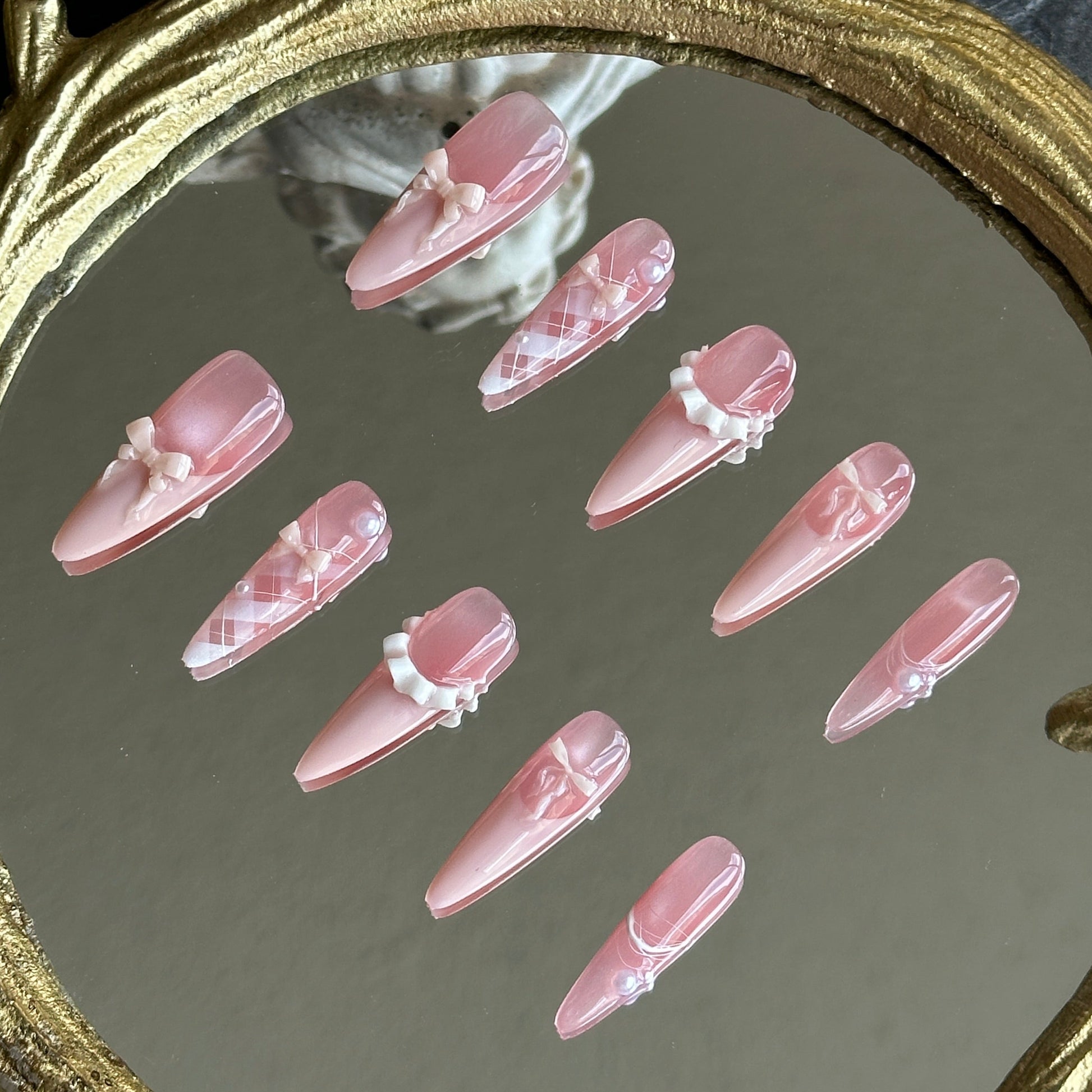 Right side view of Ballerina nails by MYOB Nails highlighting the handcrafted 3D ribbon bows and elegant lace patterns.