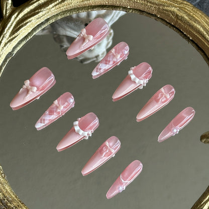 Right side view of Ballerina nails by MYOB Nails highlighting the handcrafted 3D ribbon bows and elegant lace patterns.