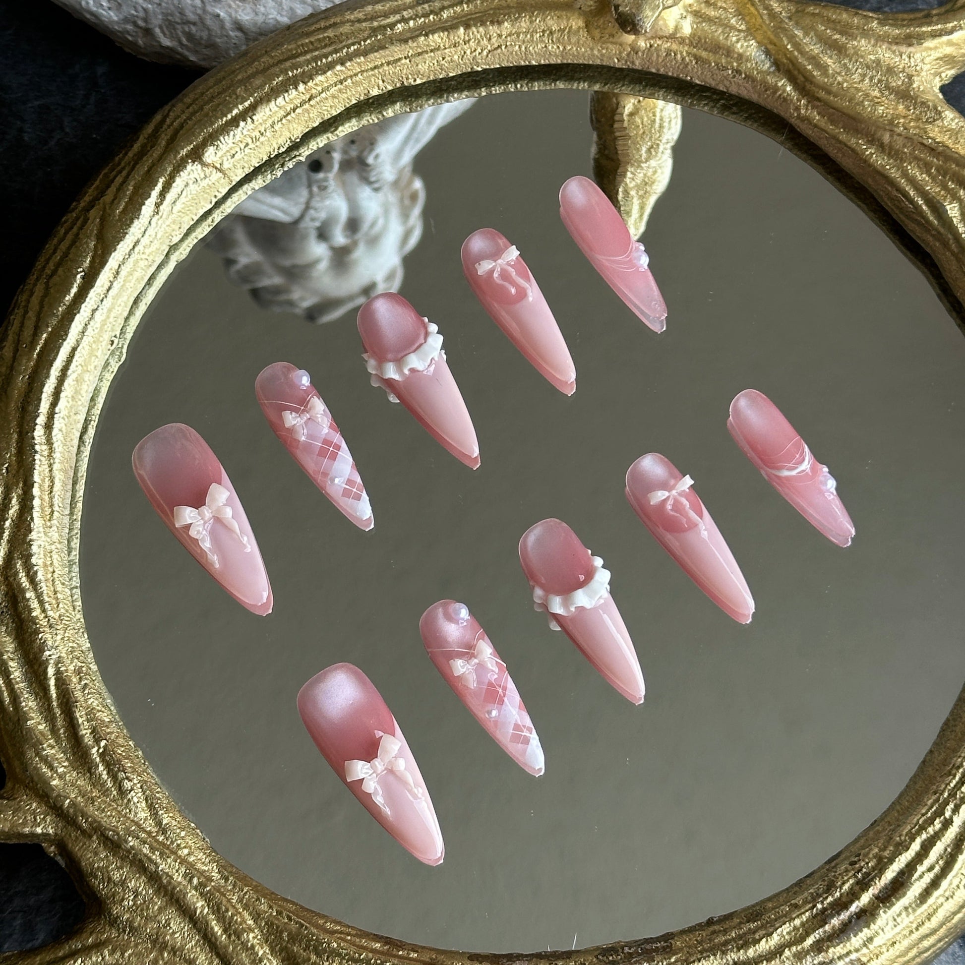 Left side detail of MYOB Nails Ballerina set showing the luminous pink cat-eye effect and tiny pearl accents.