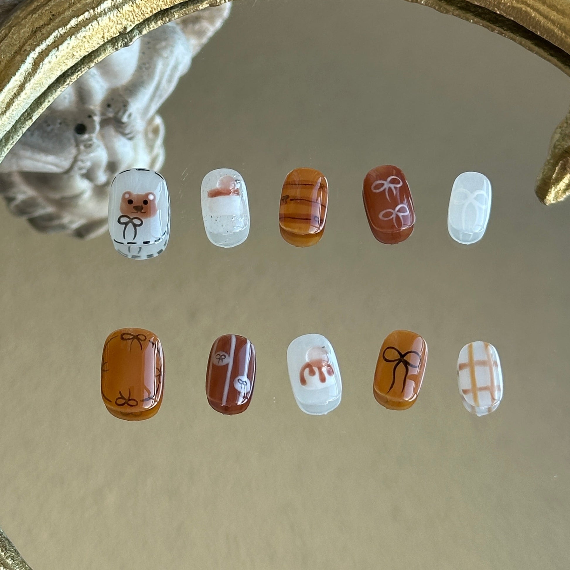 cute short nail with brown and milky white. hand sculpted pudding and hand-painted bear