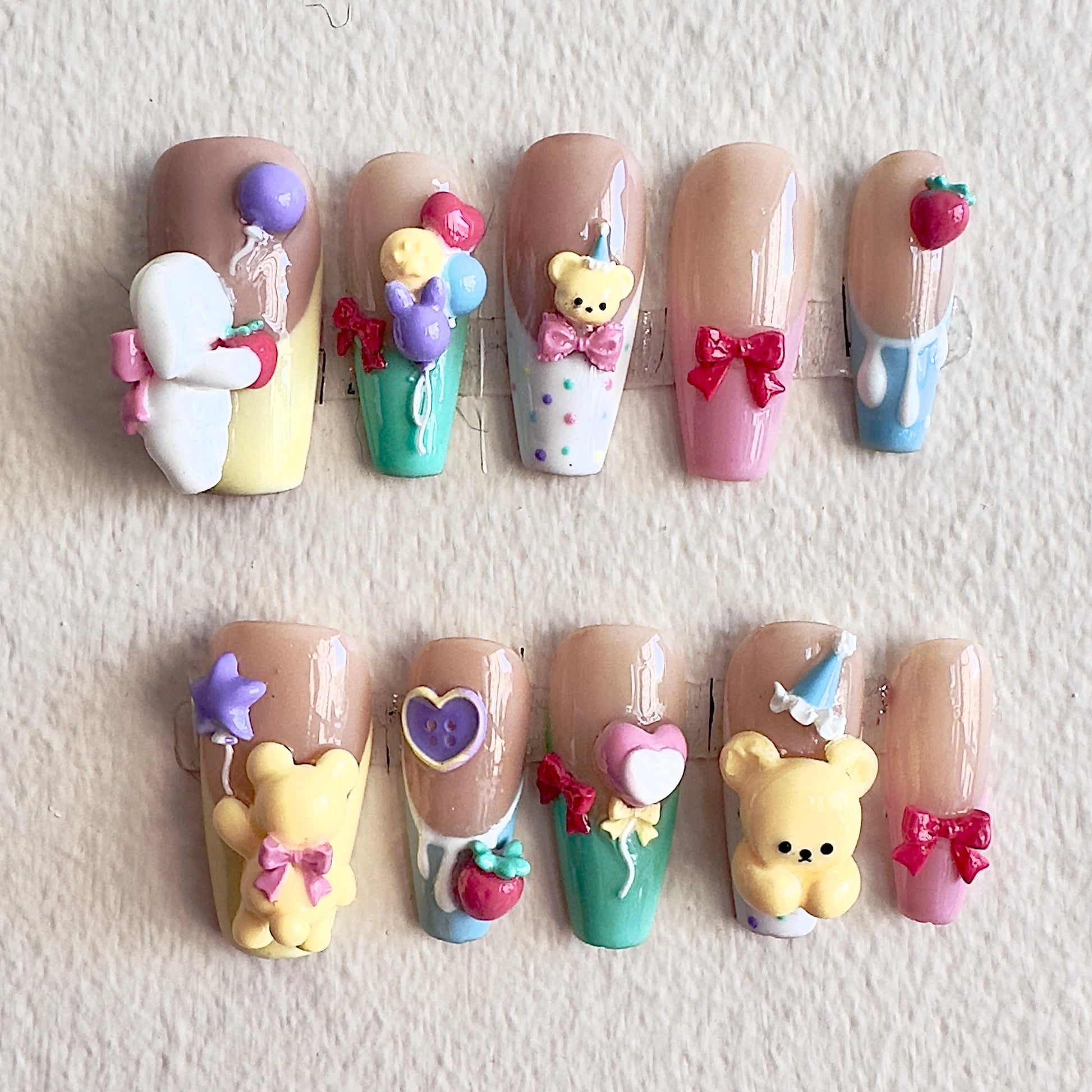 Front view of Bearthday Party nails showing the vibrant pastel French tips and playful 3D characters.