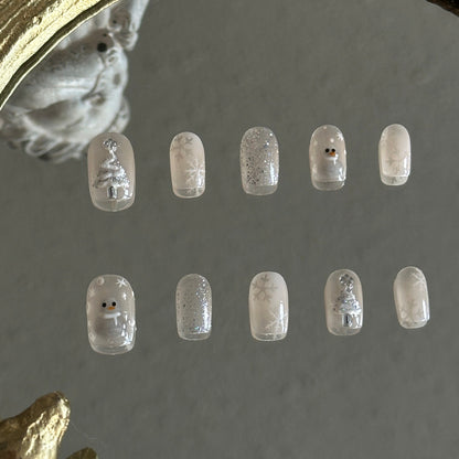 cateye and gitter based christmas nail set wih christmas tree, snowman and snowflakes. 
