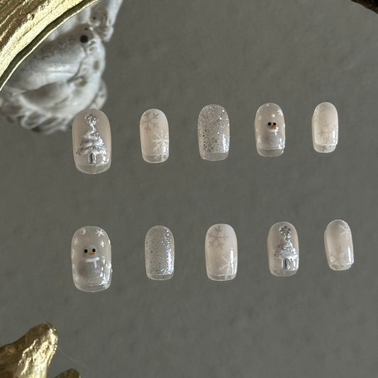 cateye and gitter based christmas nail set wih christmas tree, snowman and snowflakes. 