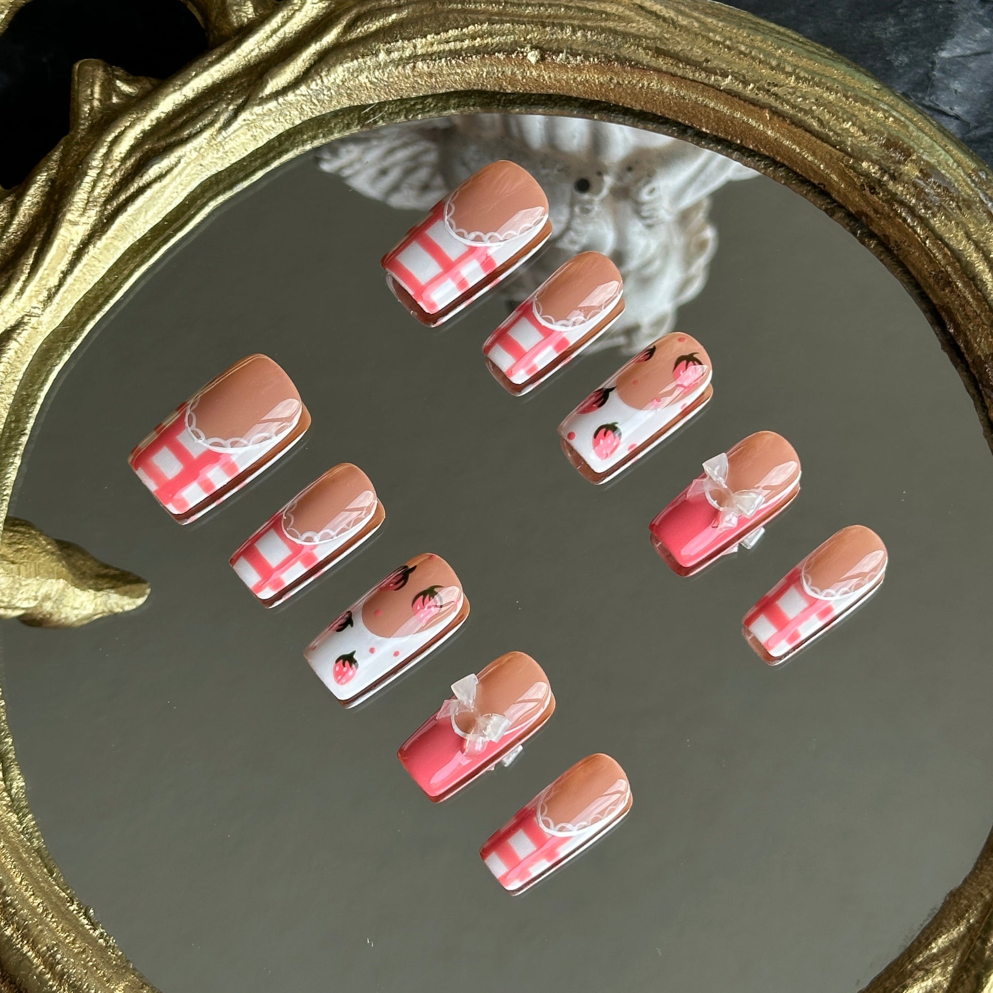 Right side view of Berry Gingham nails by MYOB Nails showing the intricate white lace borders and classic red gingham print.