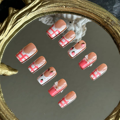 Right side view of Berry Gingham nails by MYOB Nails showing the intricate white lace borders and classic red gingham print.