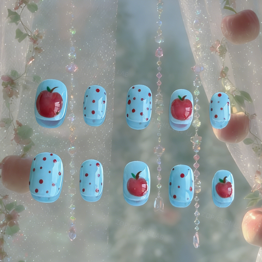 Bite Me press-on nails by MYOB Nails featuring a vibrant blue base with red polka dots and 3D sculpted apples.