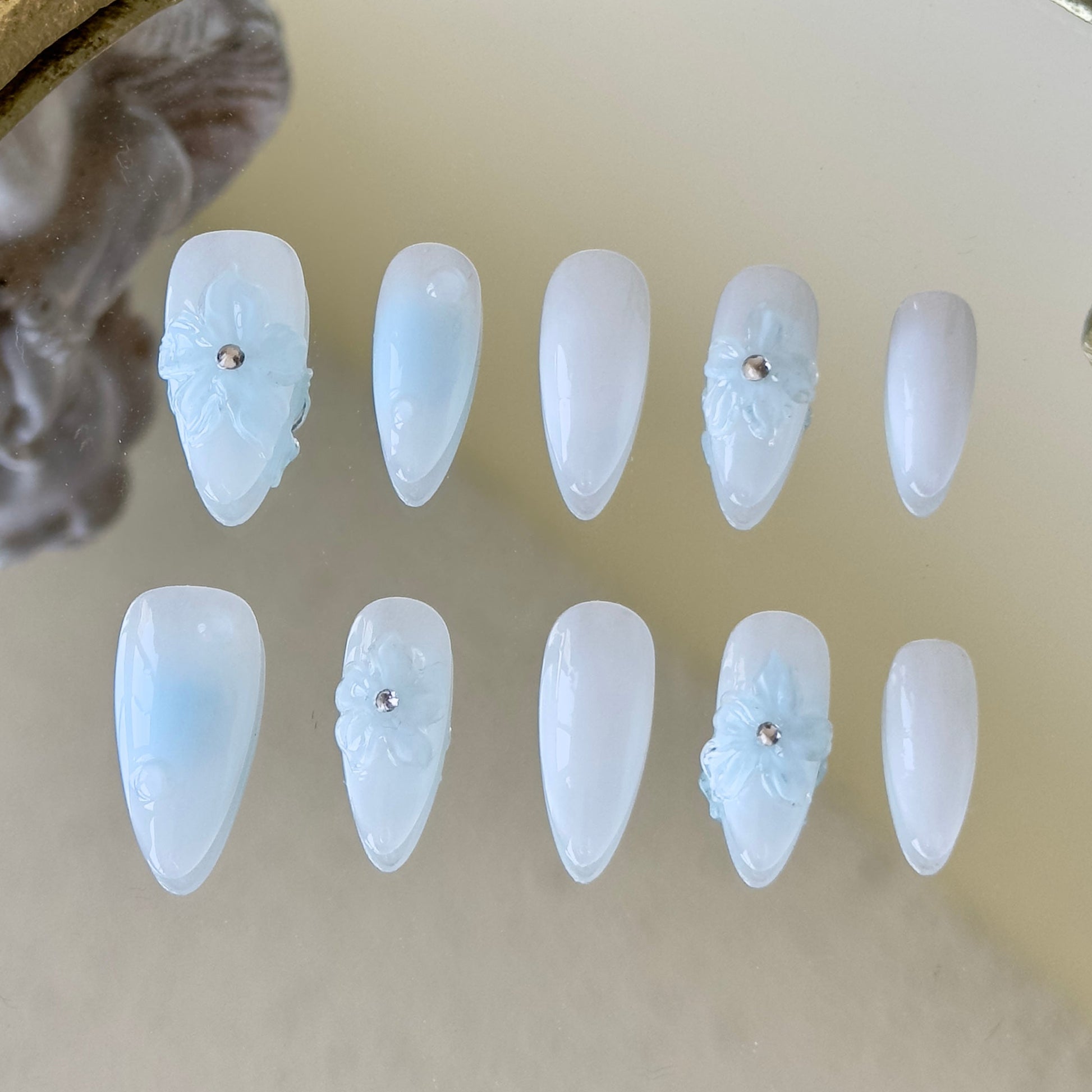 Soft blue blush gradient with a sheer white overlay for a misty winter aesthetic.