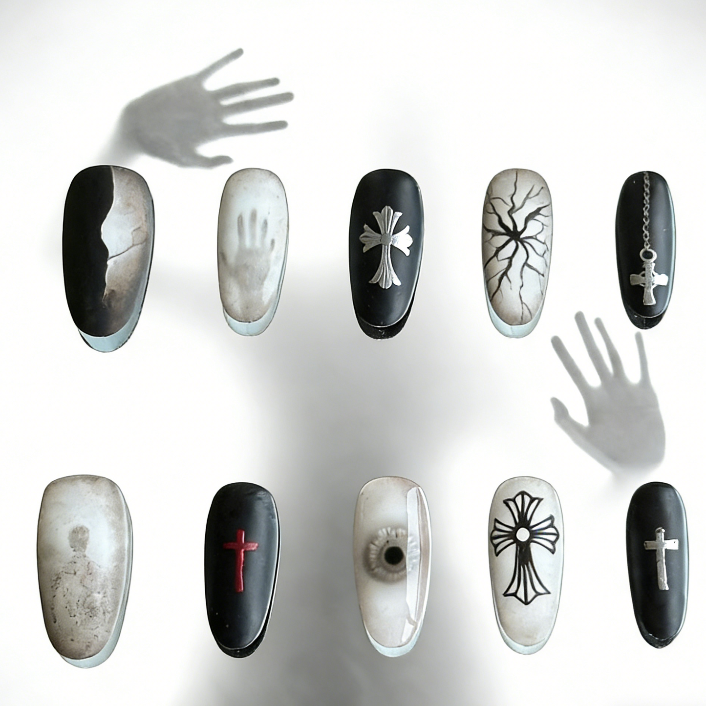 Blur press-on nails by MYOB Nails, featuring edgy gothic-inspired cross motifs and artistic hand-shadow designs.