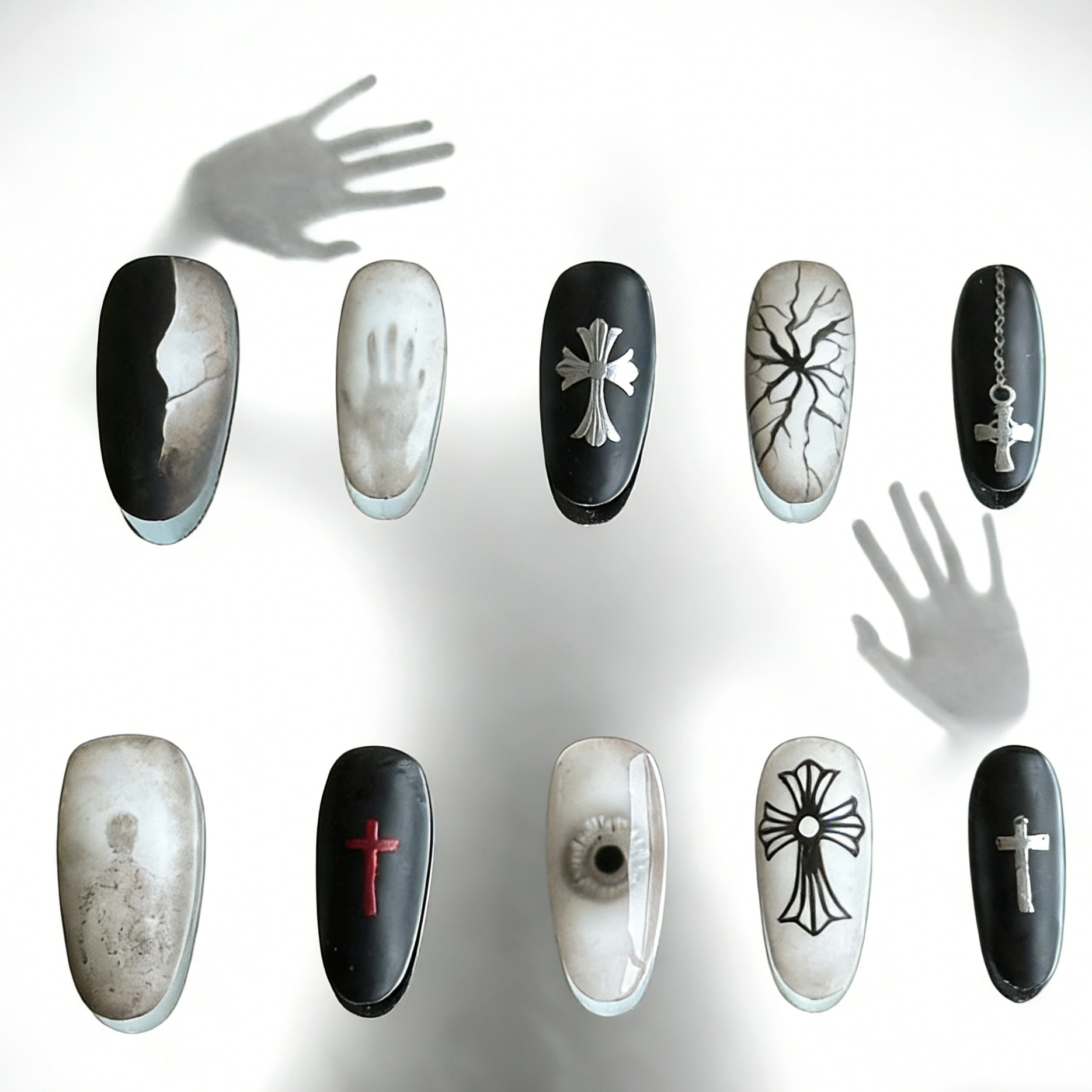 Blur press-on nails by MYOB Nails, featuring edgy gothic-inspired cross motifs and artistic hand-shadow designs.
