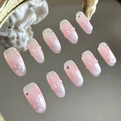 Left side detail of the nail set highlighting the central pink blush gradient and hand-painted pink leopard spots on purple cat-eye.