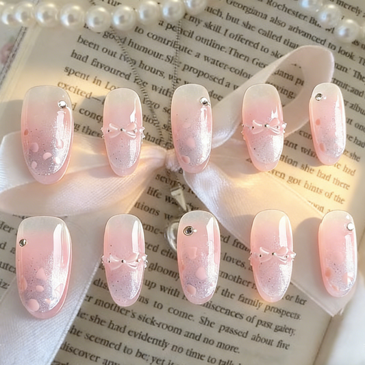 Bow Me Softly press-on nails by MYOB Nails featuring blush ombre and purple cat-eye tips on a soft feminine background.