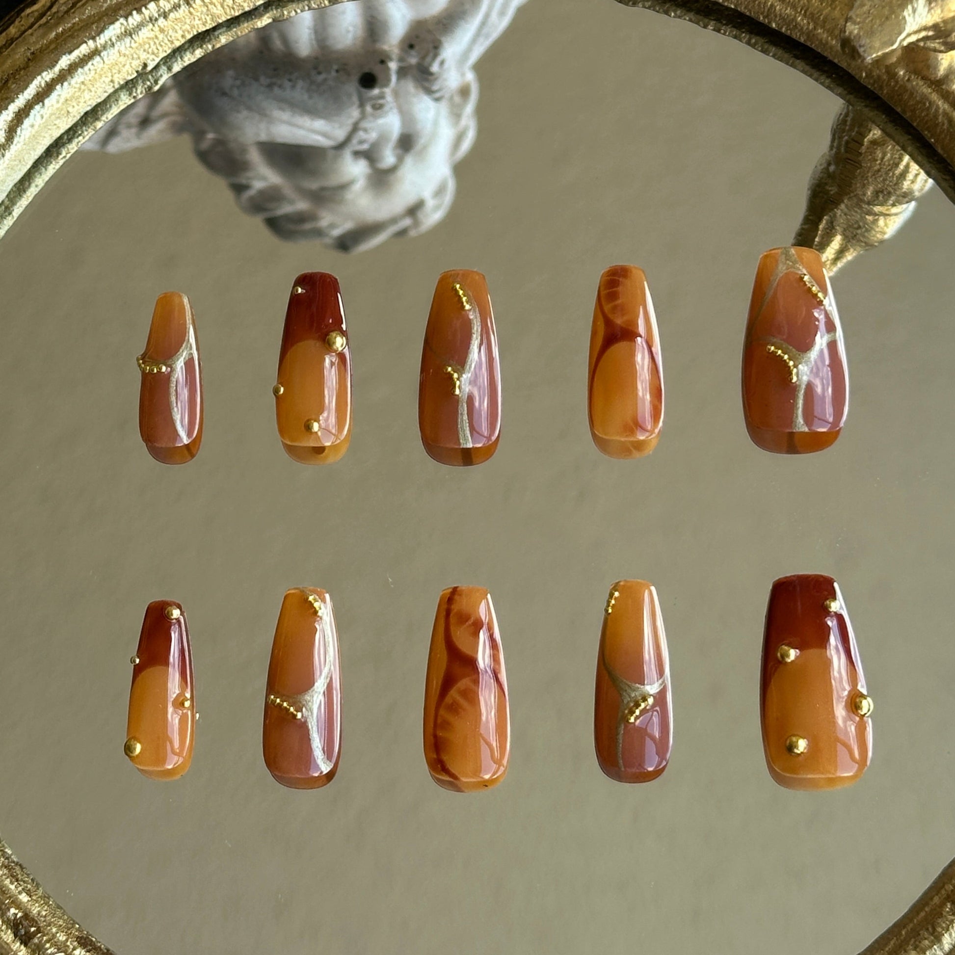 Back view of the Caramel Stone handcrafted nail set by MYOB Nails, displaying a rich and warm autumn aesthetic.