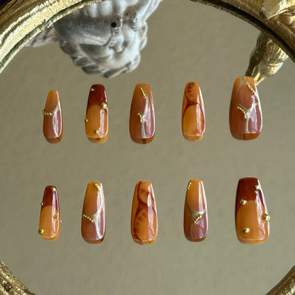 Back view of the Caramel Stone handcrafted nail set by MYOB Nails, displaying a rich and warm autumn aesthetic.