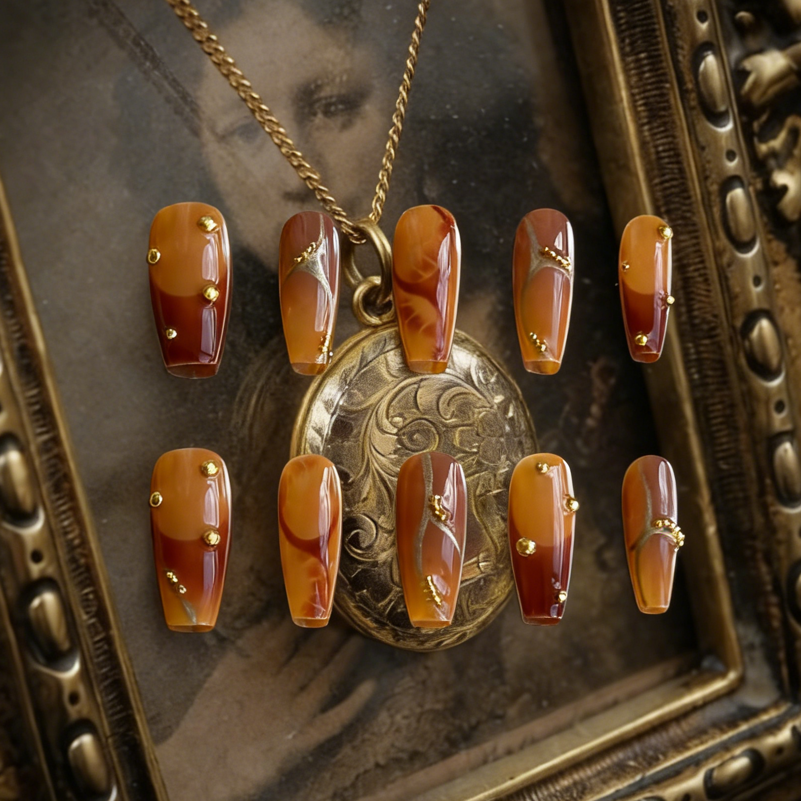 Caramel Stone press-on nails by MYOB Nails featuring an elegant brown gradient, gold accents, and decorative nail art.