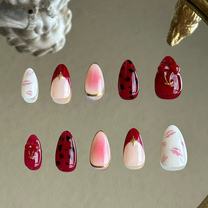 Back view showcasing the irregular gold chrome borders and the soft red blush gradient on the middle finger.