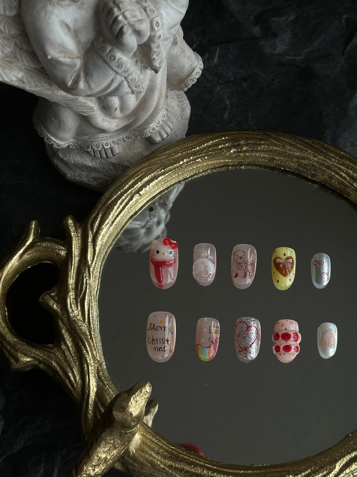 cute christmas kitty nail set with hand-sculpted designs and hand-painted sock and other detailed hoilday vibe designs