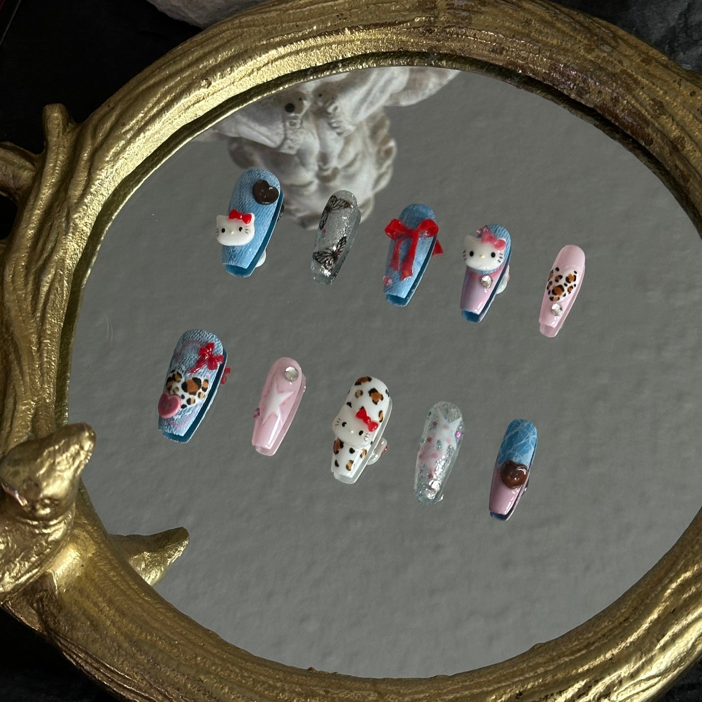 Left side mirror reflection of Cozy Cowgirl nails, detailing the matte denim texture and precision painting by MYOB Nails.