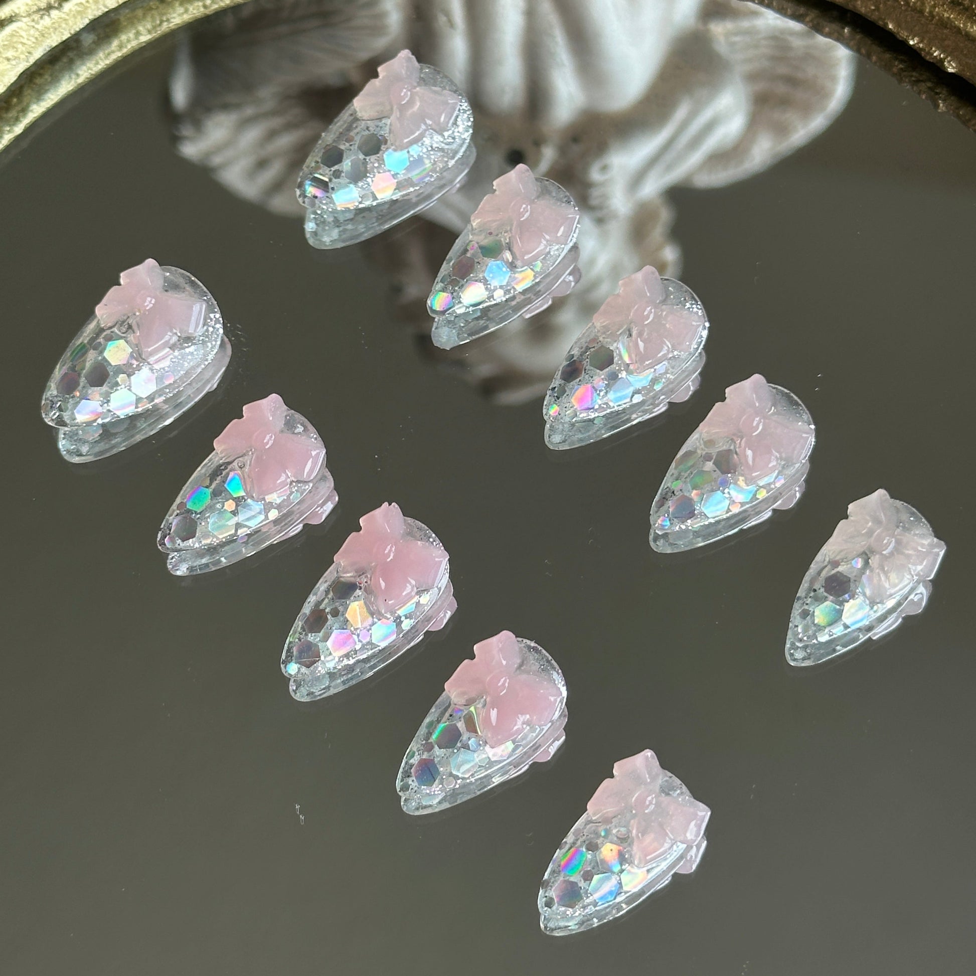 Right side view of Crystal Confections nails by MYOB Nails highlighting the delicate, jelly-like 3D sheer pink ribbon bow.
