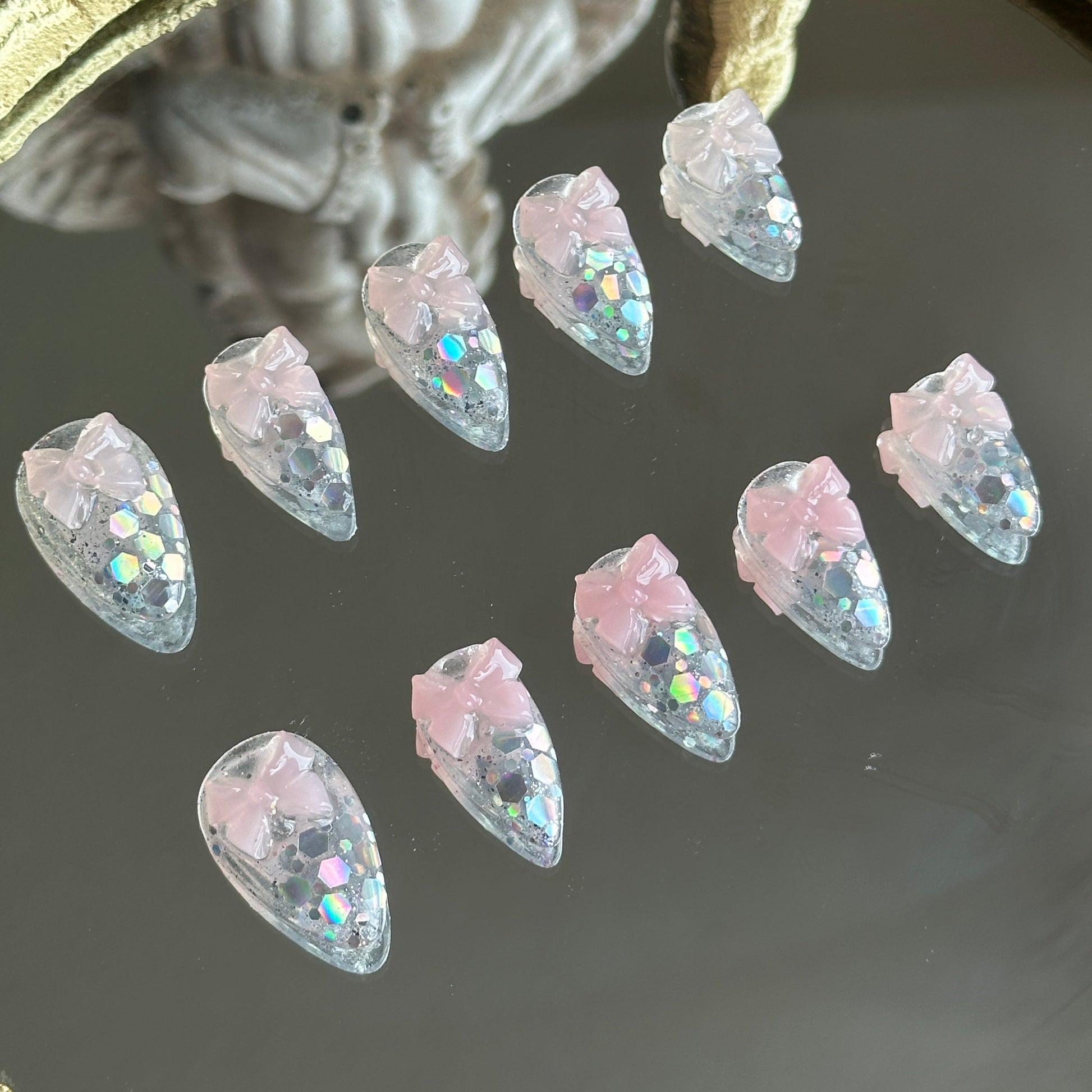 Left side detail of MYOB Nails Crystal Confections set showcasing the multi-dimensional shine of laser glitters on a transparent base.