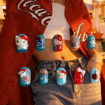 Denim Charm press-on nails by MYOB Nails, featuring playful cat-themed character art, sweet cherry motifs, and vibrant blue and red accents for a casual, youthful aesthetic.
