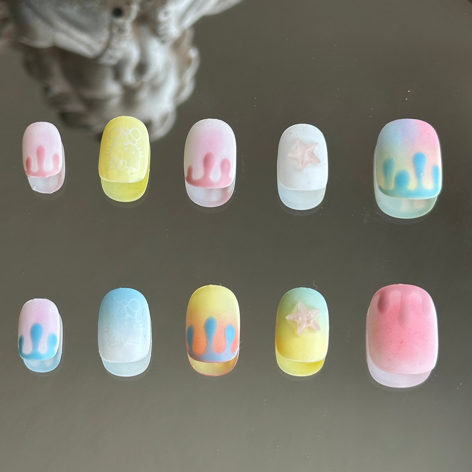 Back view showcasing the smooth velvet matte finish across the orange and white gradient nail tips.