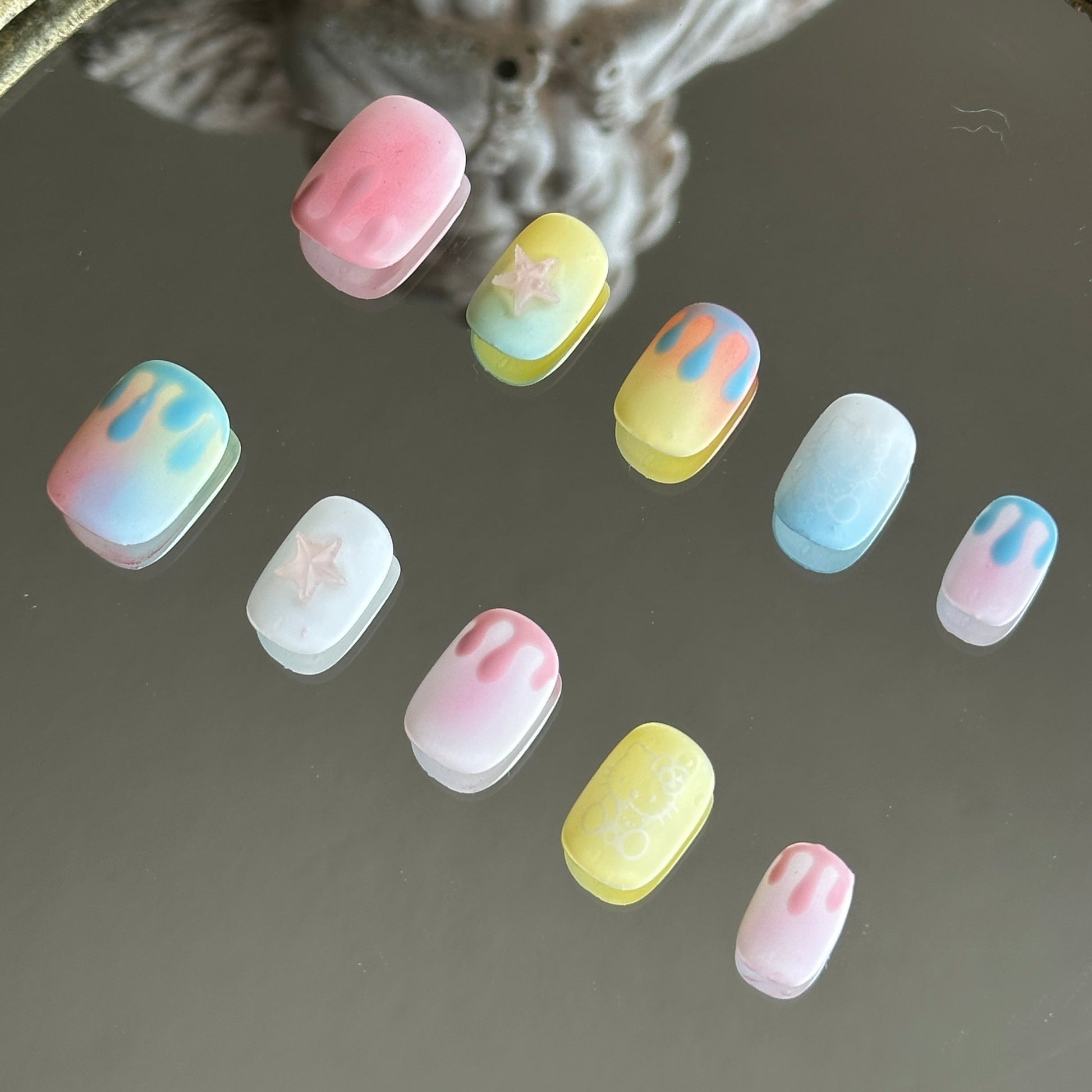 Right side view highlighting the hand-painted water drop motifs and a whimsical white feline outline.