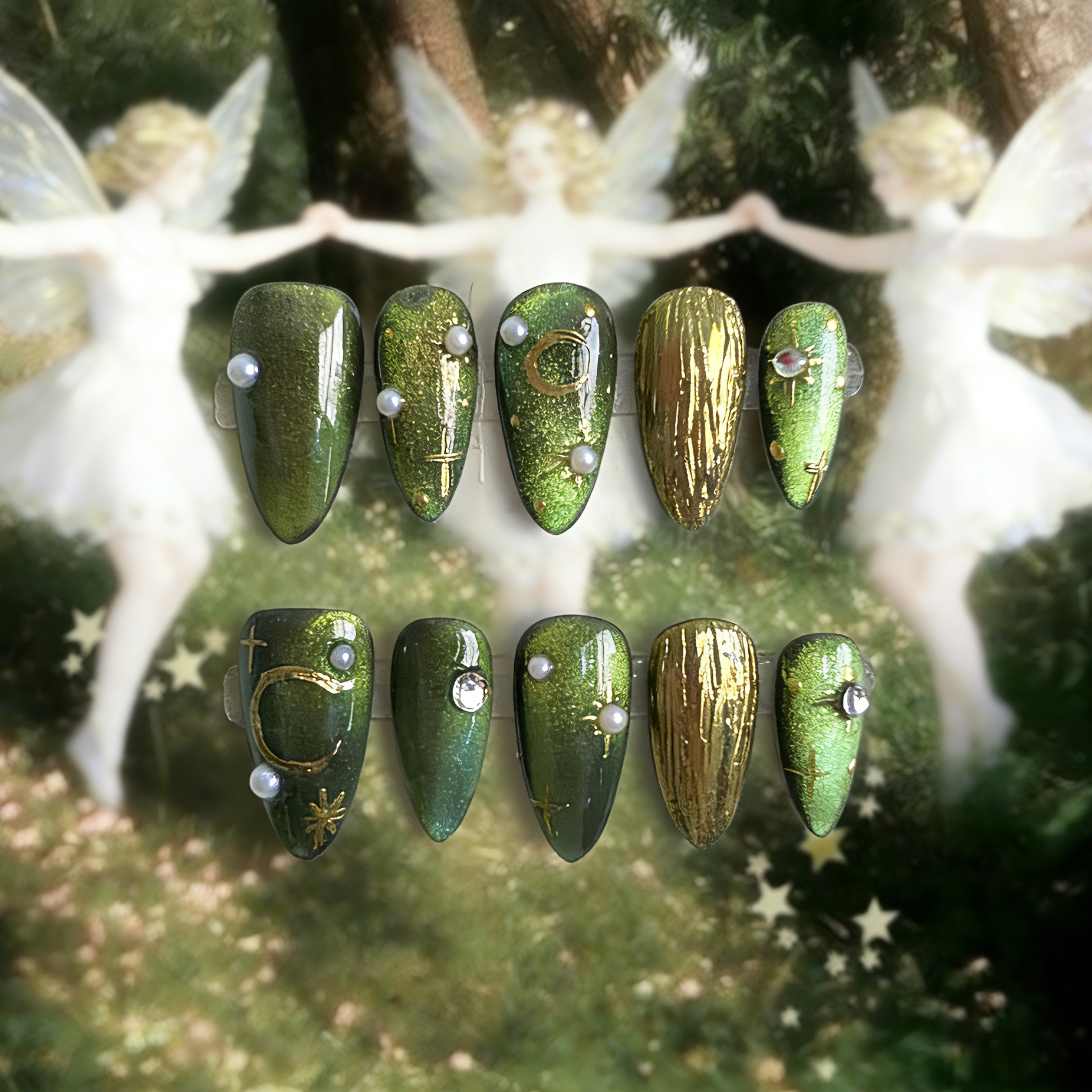 Emerald Elixir press-on nails by MYOB Nails featuring green cat-eye effects, gold chrome moons, and star accents.