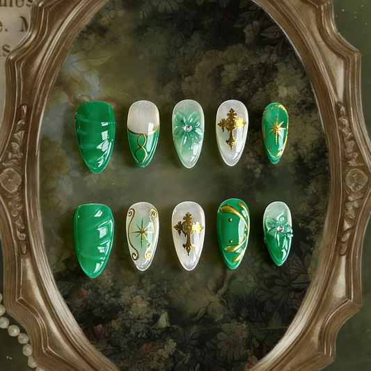 Emerald Sigil press-on nails by MYOB Nails displayed within an ornate vintage baroque frame, creating a luxurious royal aesthetic.
