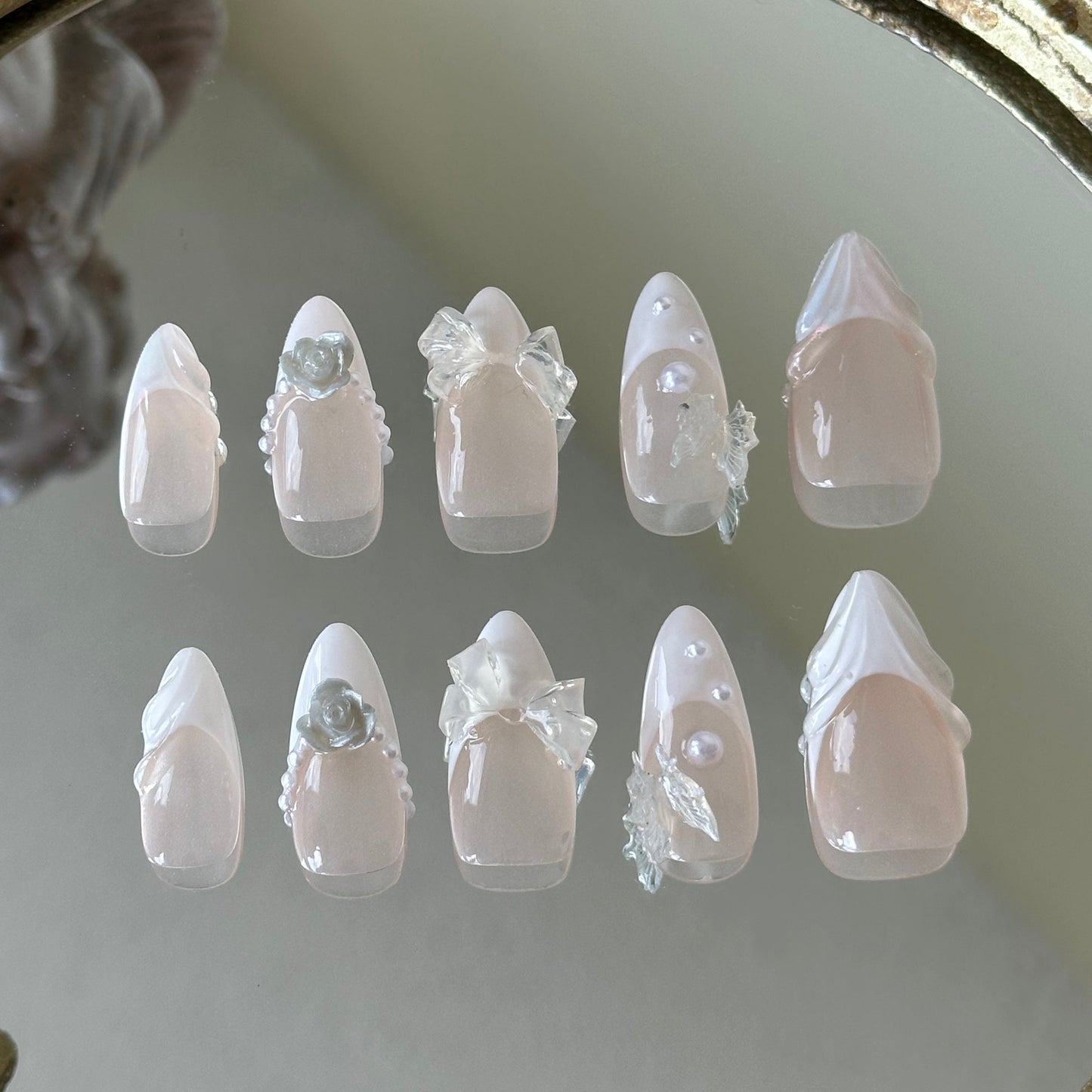 Back view showcasing the elegant almond shape and the luminous sheer nude finish of the Fairy Bride set.