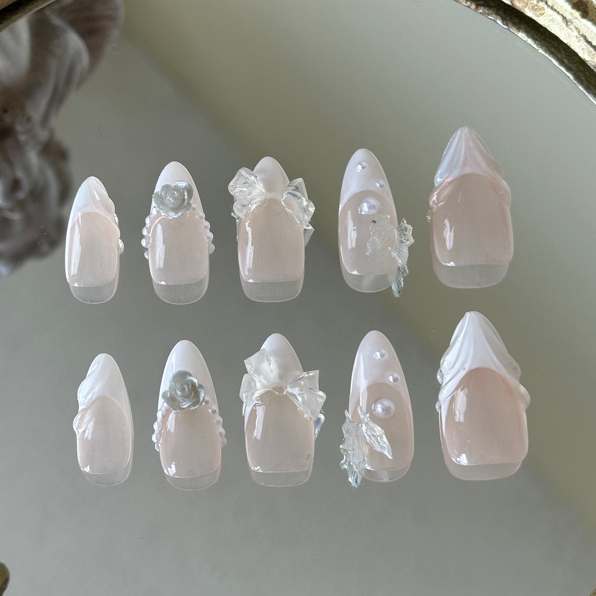 Back view showcasing the elegant almond shape and the luminous sheer nude finish of the Fairy Bride set.