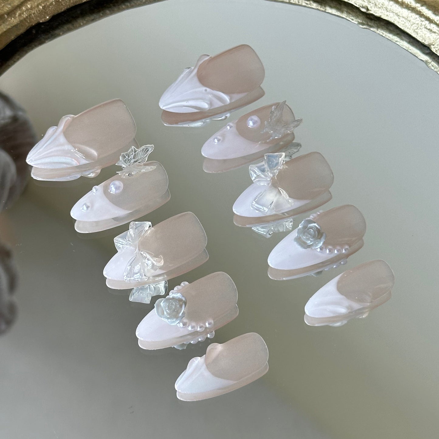 Side view highlighting the delicate 3D white roses, transparent bows, and pearlescent details.