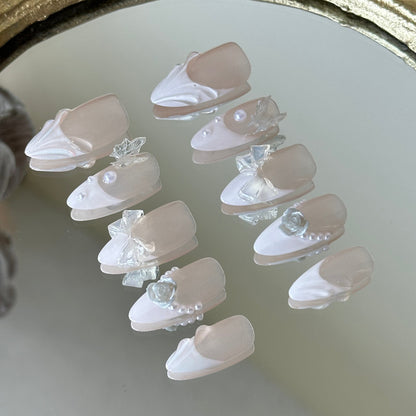 Side view highlighting the delicate 3D white roses, transparent bows, and pearlescent details.