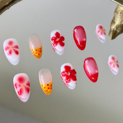 Close-up of the playful yellow French tips paired with bold red polka dots on a natural nude base.