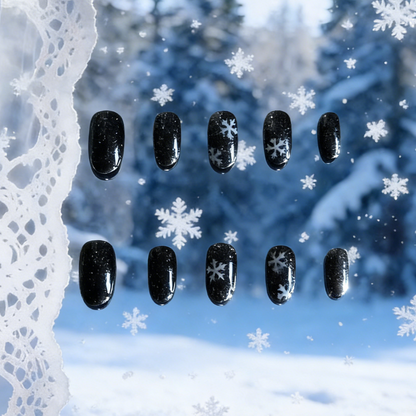 Frosted Night press-on nails by MYOB Nails featuring black base with white snowflake winter patterns.