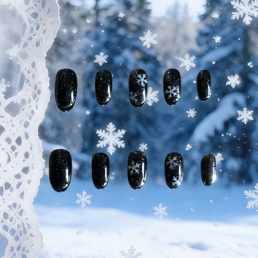 Frosted Night press-on nails by MYOB Nails featuring black base with white snowflake winter patterns.