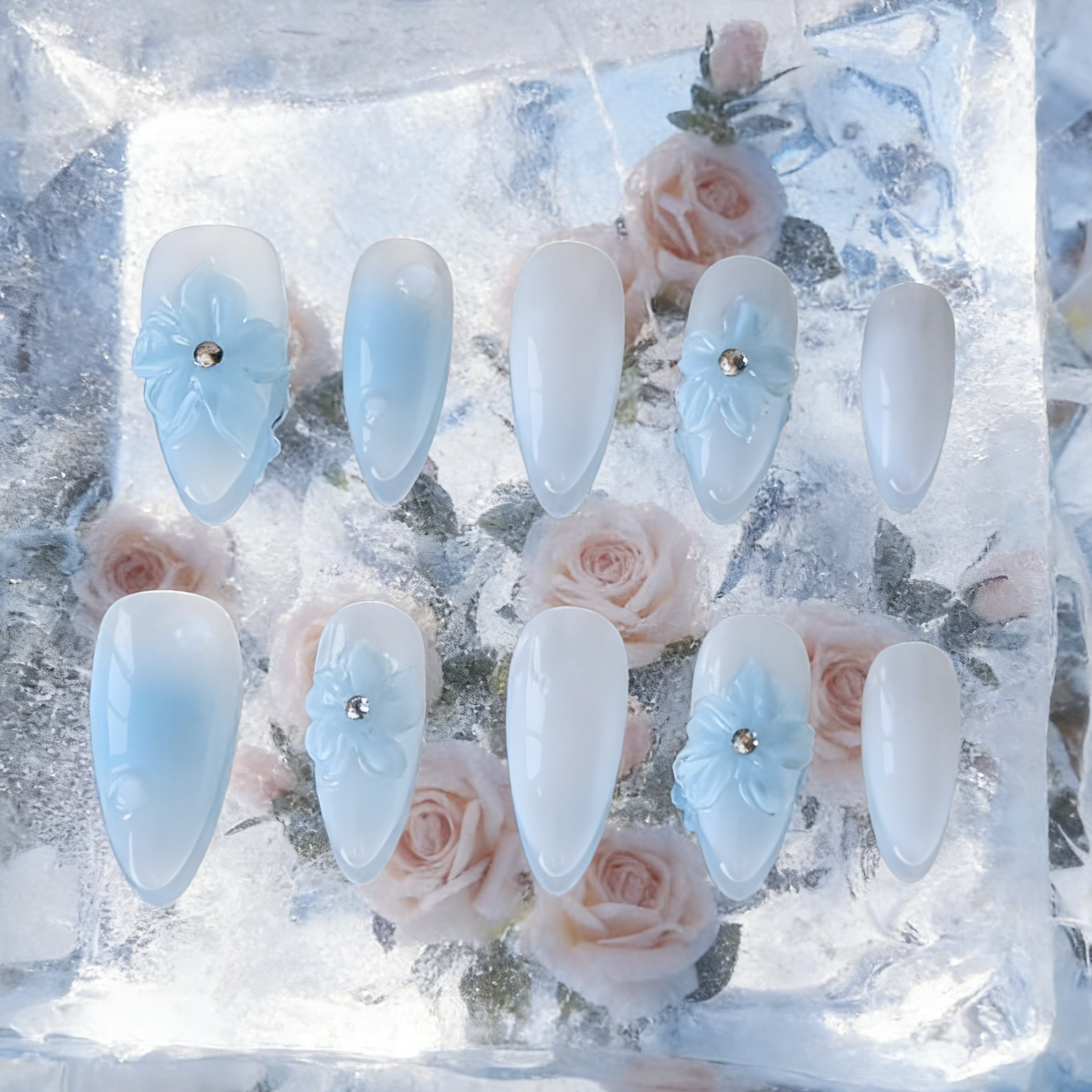 Frozen Petals by MYOB Nails featuring 3D blue flowers encapsulated in a clear ice-like layer.