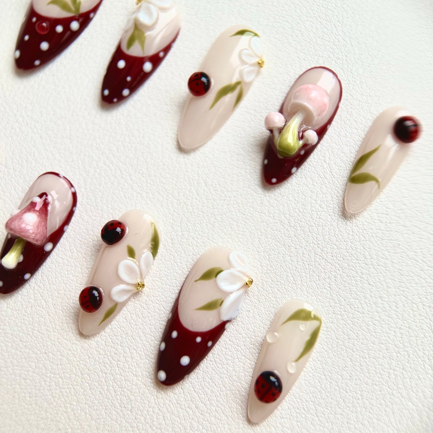 Side view highlighting the vivid 3D red ladybugs and the organic hand-painted green leaf details.