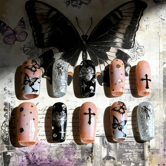 Gothic Flutter press-on nails by MYOB Nails styled on a vintage dark floral background with hauntingly beautiful butterfly motifs.