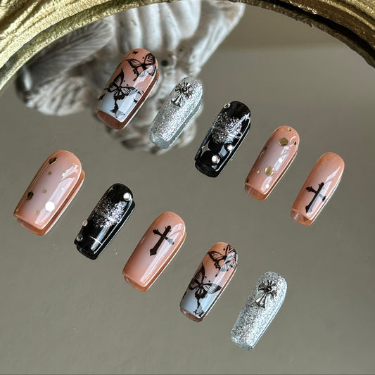 Right side view of Gothic Flutter nails by MYOB Nails showing the delicate black thorn vines and gothic-inspired accents.