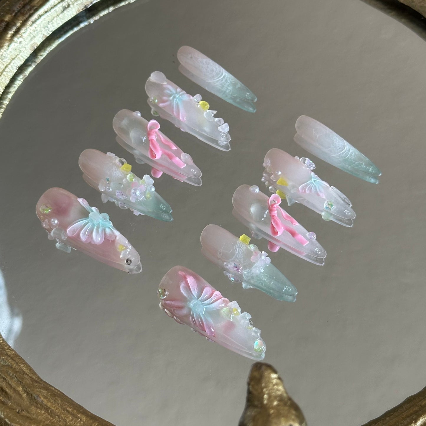 Close-up detail of the handcrafted 3D pink butterfly on a shimmering pink cat-eye base from the A Letter from Spring set.