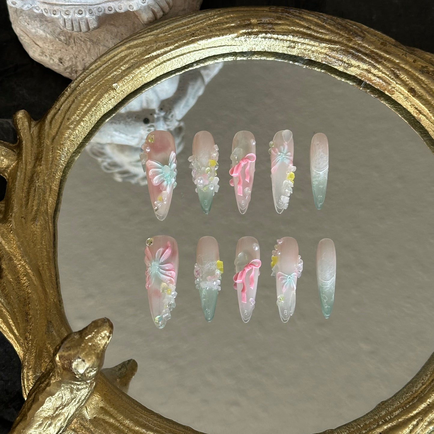 Front view of A Letter from Spring nails showcasing the sheer, jelly-like quality, glitter 'gravel' texture, and 3D floral accents.