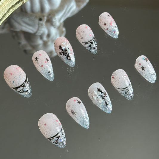 Left side detail of the nails highlighting the delicate hand-painted black lace hollow French tips.