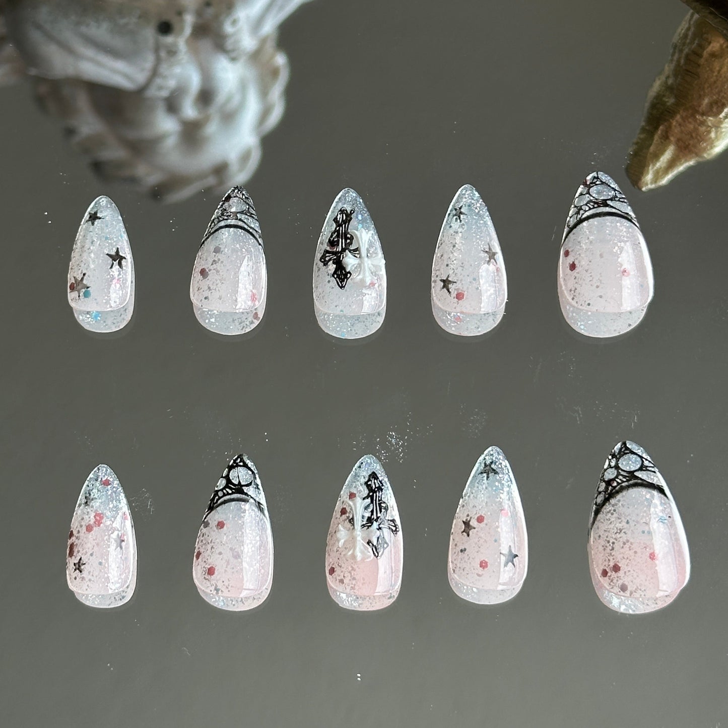 Back view of the set highlighting the subtle shimmer of silver and pink glitters under the nude pink gradient.